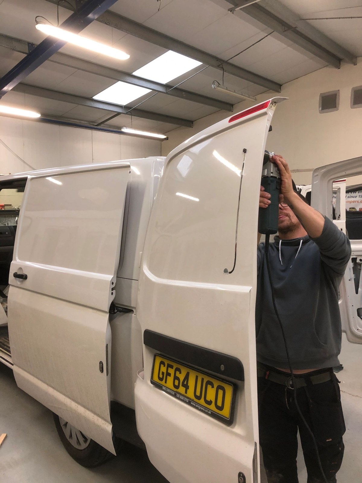 Hands-on work on the rear of a campervan