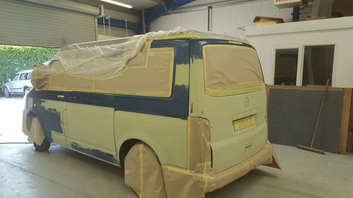 A van masked and prepared for exterior paintwork