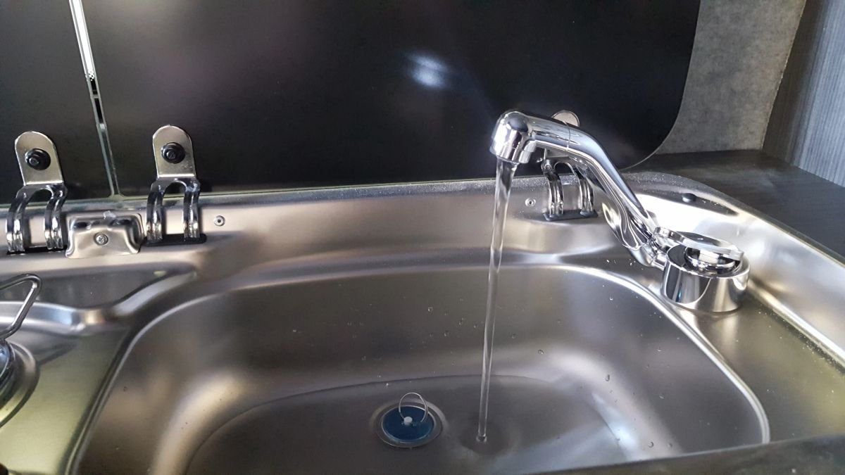 A fitted campervan sink and tap