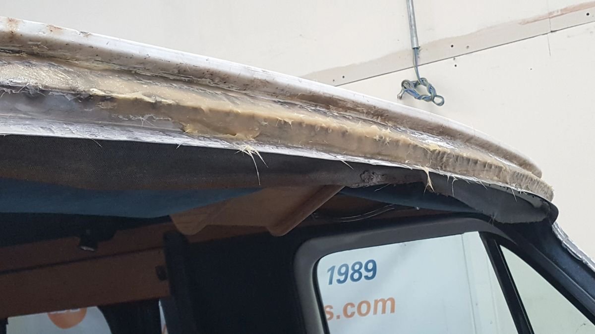 A stripped roof edge showing bodywork that needs repair