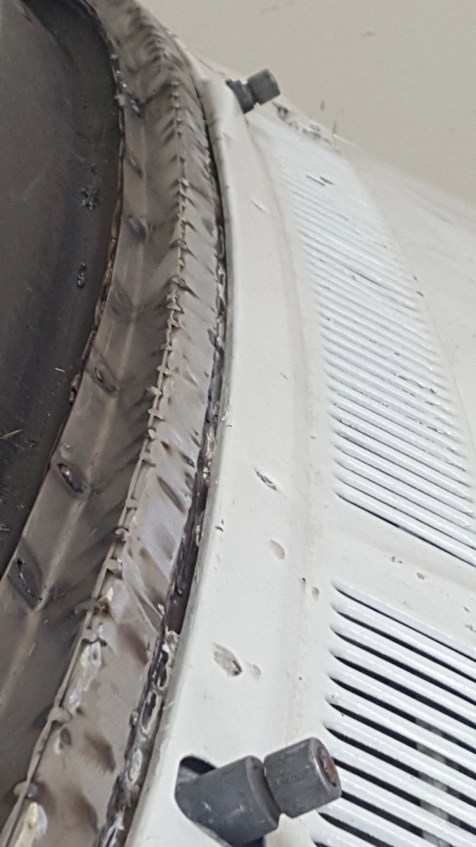 Close-up of exposed metal along a van roof seam